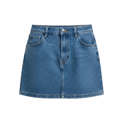Blue denim skirt with white polka dots on a white background