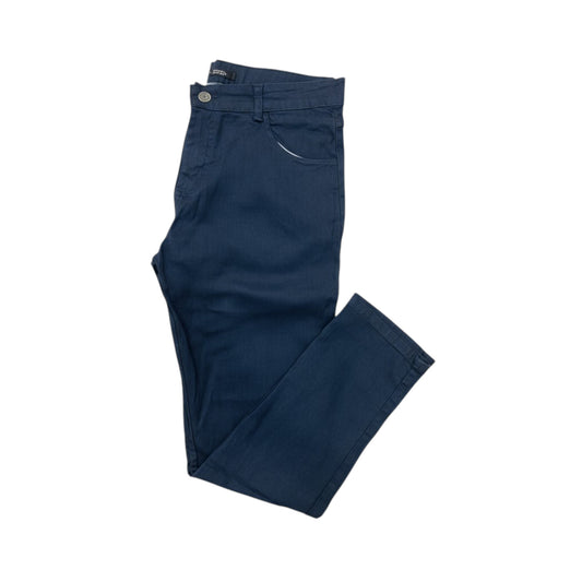 Folded navy blue pants on a white background