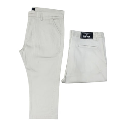 Light gray pants with a brand label on a white background