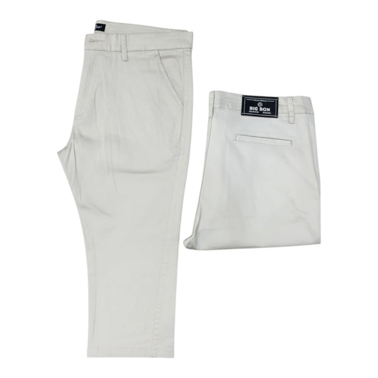 Light gray pants with a brand label on a white background