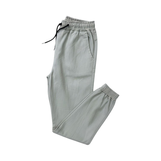 Light gray sweatpants with drawstring on a white background
