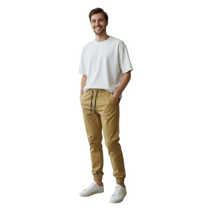Man wearing a white t-shirt and beige pants on a white background